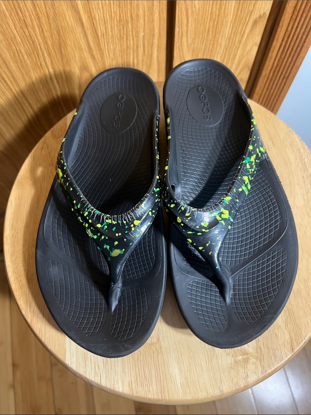 OOFOS Black Flip Flop Sandals with Neon Green Splatter